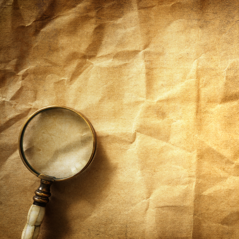Vintage background with magnifying glass